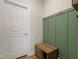 Convenient mud room with coat hooks, bench, and storage, perfect for organization at 624 Red Arrow Dr, Knightdale, NC 27545