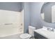 Bathroom with tub, toilet, and vanity with sink at 636 Tucker St, Burlington, NC 27215