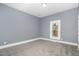 Bedroom featuring neutral walls, carpet flooring, and a window at 636 Tucker St, Burlington, NC 27215