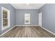 Inviting living room featuring fresh paint, attractive floors, and bright windows, offering comfort at 636 Tucker St, Burlington, NC 27215