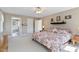Bedroom with floral comforter, neutral walls, and 3 windows for plenty of light at 6404 Pulley Town Rd, Wake Forest, NC 27587