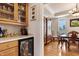 Elegant dining area with wood floors, china cabinet and wine cooler, perfect for entertaining guests at 6404 Pulley Town Rd, Wake Forest, NC 27587