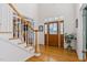 Bright entryway with hardwood floors, staircase, and decorative front door with sidelights at 6404 Pulley Town Rd, Wake Forest, NC 27587