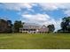 Spacious brick home with a large front yard and covered porch at 6404 Pulley Town Rd, Wake Forest, NC 27587