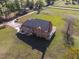 An aerial view of the home showing it's backyard and outdoor living spaces at 6404 Pulley Town Rd, Wake Forest, NC 27587