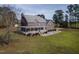 Charming brick home featuring a spacious wrap-around porch and meticulously landscaped front yard at 6404 Pulley Town Rd, Wake Forest, NC 27587
