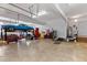 Spacious garage with a vehicle lift, ample storage, and bright lighting at 6404 Pulley Town Rd, Wake Forest, NC 27587