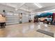 Well-lit garage with two doors and a vehicle lift, offering plenty of space at 6404 Pulley Town Rd, Wake Forest, NC 27587