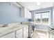 Convenient laundry room equipped with washer, dryer, storage cabinets and sink, ensuring effortless chores at 6404 Pulley Town Rd, Wake Forest, NC 27587