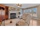 Comfortable living room featuring a fireplace, hardwood floors, and lots of natural light at 6404 Pulley Town Rd, Wake Forest, NC 27587