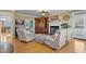 Inviting living room with hardwood floors, fireplace, and built-in shelving, creating a cozy and functional space at 6404 Pulley Town Rd, Wake Forest, NC 27587