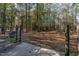 Wooded property with a metal gate at 6404 Pulley Town Rd, Wake Forest, NC 27587