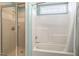 Tiled shower with glass door and bright lighting, offering a clean and modern space at 6404 Pulley Town Rd, Wake Forest, NC 27587