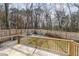 Backyard scene showcasing a wooden deck, fire pit, and seating for entertaining at 727A Peyton Ave, Durham, NC 27703
