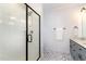 Modern bathroom features a glass-enclosed shower and stylish gray vanity at 727A Peyton Ave, Durham, NC 27703