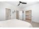 Bright bedroom with walk-in closet features comfortable bedding and neutral tones at 727A Peyton Ave, Durham, NC 27703