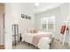 Cozy bedroom features a neutral color palette, soft textiles, and natural light at 727A Peyton Ave, Durham, NC 27703