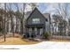 Inviting two-story home features a well-manicured lawn, front porch, and private driveway at 727A Peyton Ave, Durham, NC 27703
