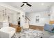 Open-concept living room with hardwood floors, fireplace, and view of the staircase at 727A Peyton Ave, Durham, NC 27703