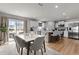 Bright and modern kitchen featuring white cabinetry, a large center island, and stainless steel appliances at 82 Coble Farms Pl, Fuquay Varina, NC 27526