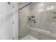 Glass enclosed shower featuring modern fixtures and tiled walls, adding a touch of elegance at 82 Coble Farms Pl, Fuquay Varina, NC 27526