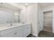 Bathroom with double sink vanity, quartz countertops, and a walk-in shower at 871 Forth Ct, Gibsonville, NC 27249