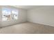Bright bedroom featuring soft carpeting and a window overlooking the neighborhood at 871 Forth Ct, Gibsonville, NC 27249