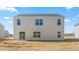 A spacious backyard with a sliding glass door offers easy access to outdoor living at 879 Forth Ct, Gibsonville, NC 27249