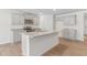 Kitchen featuring gray cabinets, granite countertops, stainless steel appliances, and an island with a sink at 879 Forth Ct, Gibsonville, NC 27249