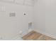 Laundry room with hookups and wood-look flooring at 879 Forth Ct, Gibsonville, NC 27249