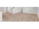 Spacious living room showcasing modern light wood flooring and staircase at 879 Forth Ct, Gibsonville, NC 27249