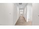Bright hallway showcasing wood-look floors, neutral walls, leading to living spaces with natural light at 880 Forth Ct, Gibsonville, NC 27249