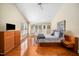Spacious bedroom featuring hardwood floors, vaulted ceiling, and great natural light at 9344 Palm Bay Cir, Raleigh, NC 27617