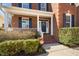 Close-up of the front porch of a brick home, showcasing the welcoming entrance at 9344 Palm Bay Cir, Raleigh, NC 27617