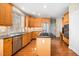 Open kitchen featuring wood cabinets, granite countertops, and stainless-steel appliances at 9344 Palm Bay Cir, Raleigh, NC 27617