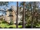 Home exterior showcasing backyard, back deck, and lush, mature landscaping, creating a private oasis at 9344 Palm Bay Cir, Raleigh, NC 27617