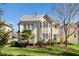 Well-manicured lawn surrounds the rear of the home, highlighting the architecture and outdoor space at 9344 Palm Bay Cir, Raleigh, NC 27617