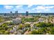 Aerial view of the city showcasing the skyline and neighborhood with lush trees at 101 N Bloodworth St, Raleigh, NC 27601