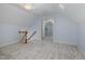 Attic with neutral carpet and an open doorway to additional space at 101 N Bloodworth St, Raleigh, NC 27601