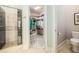 Bathroom featuring a walk-in closet and a glass-enclosed shower with decorative tile at 101 N Bloodworth St, Raleigh, NC 27601