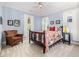 Comfortable bedroom with neutral carpet, ceiling fan and two windows with curtains at 101 N Bloodworth St, Raleigh, NC 27601
