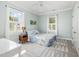 Cozy bedroom with large windows, light paint, and a ceiling fan at 101 N Bloodworth St, Raleigh, NC 27601
