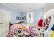 Comfortable bedroom with neutral carpet, ceiling fan and a window with shutters at 101 N Bloodworth St, Raleigh, NC 27601