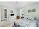 Bright bedroom with a desk, stylish decor, and comfortable carpet flooring at 101 N Bloodworth St, Raleigh, NC 27601