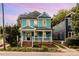 Charming two-story home featuring a spacious front porch and manicured lawn at 101 N Bloodworth St, Raleigh, NC 27601