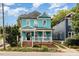 Two-story home with a covered porch, brick foundation, and attractive landscaping at 101 N Bloodworth St, Raleigh, NC 27601
