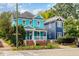 Two-story home with a covered porch, brick foundation, and lush front yard at 101 N Bloodworth St, Raleigh, NC 27601