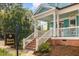 Charming home with brick foundation, covered porch, and manicured landscaping at 101 N Bloodworth St, Raleigh, NC 27601