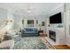 Inviting living room featuring a stone fireplace, bay window and comfortable furniture at 101 N Bloodworth St, Raleigh, NC 27601