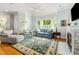 Comfortable living room with fireplace, large windows, and natural light at 101 N Bloodworth St, Raleigh, NC 27601